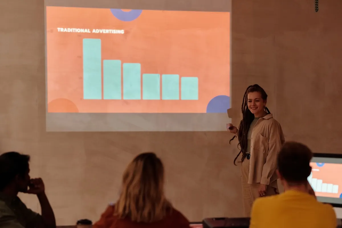 Young professional presenting data with graph in a business meeting.